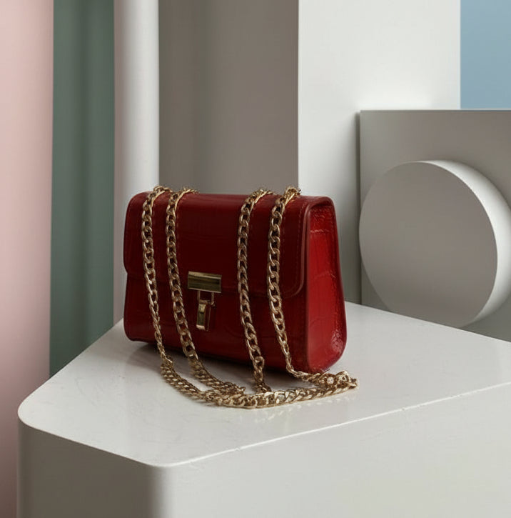 small red shoulder or crossbody bag