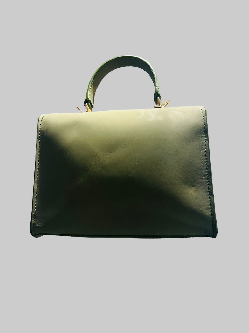 olive-green top-handle handbag with a detachable shoulder strap.